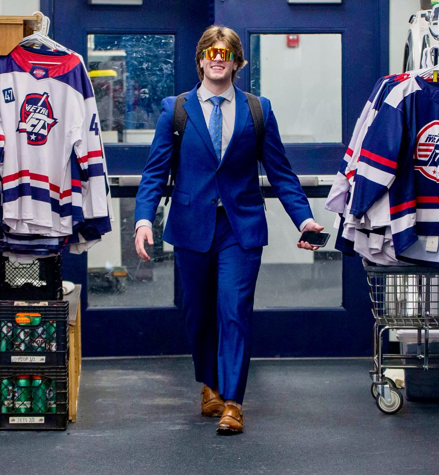#MetroJets defenseman Michael “Shades” Lucia heads to the room to get suited up before a 2023-24 game at Mount Clemens Ice Arena.

#PlayerEntranceThursday #PlayLikeBray