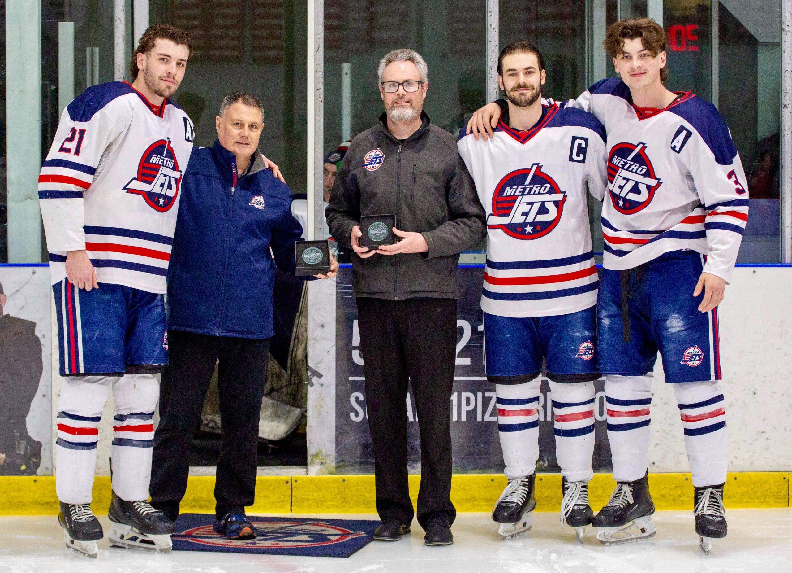 #MetroJets staffers Dave Ross and Paul “Paulie” Sheridan are honored prior to the team’s #USPHLPlayoffs game March 7, 2026 at Mount Clemens Ice Arena against the Red River Spartans.
Dave was honored for 25 years as the team’s trainer before calling it a career after the season and Paulie for 20 years as the team’s equipment manager.
With Dave and Paulie are 2025-26 captains Enrick Fournier, Jake Taylor and AJ Zaccagni.
#TwoForTuesday #PlayLikeBray